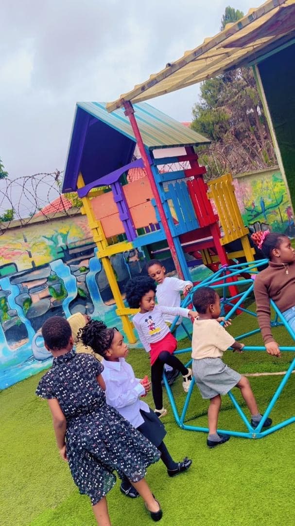 Children playing on the colourful climbing frame.